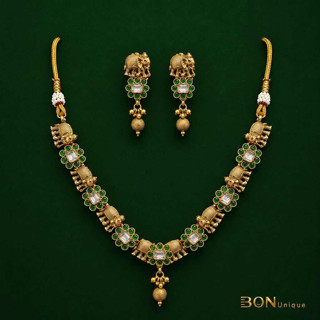 Model wearing elephant motif kundan necklace set with matching earrings on saree