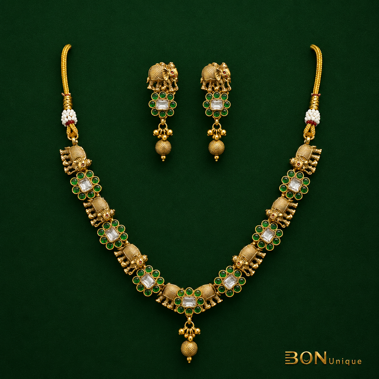 Model wearing elephant motif kundan necklace set with matching earrings on saree
