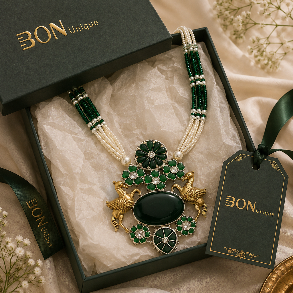 Antique gold dual Pegasus necklace with green enamel in BON Unique signature gift box