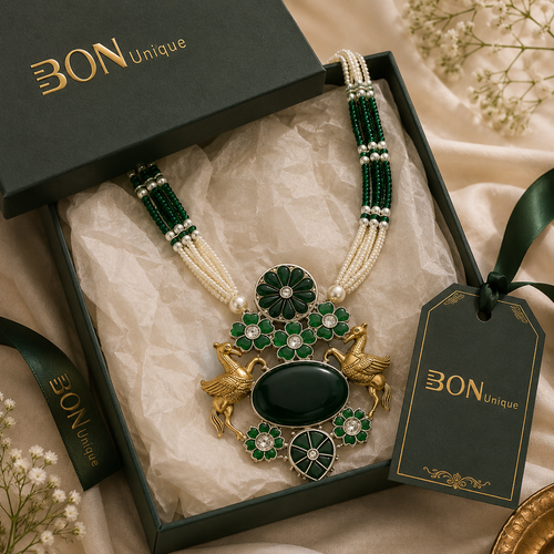 Antique gold dual Pegasus necklace with green enamel in BON Unique signature gift box
