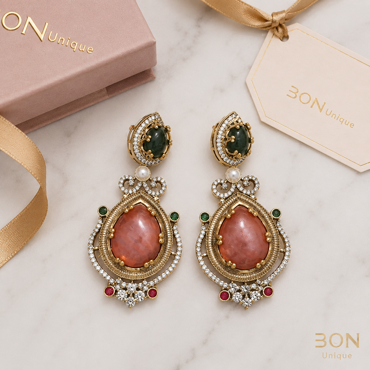 Rhodonite & Emerald Royal Drop Earrings flat lay with BON Unique gift box