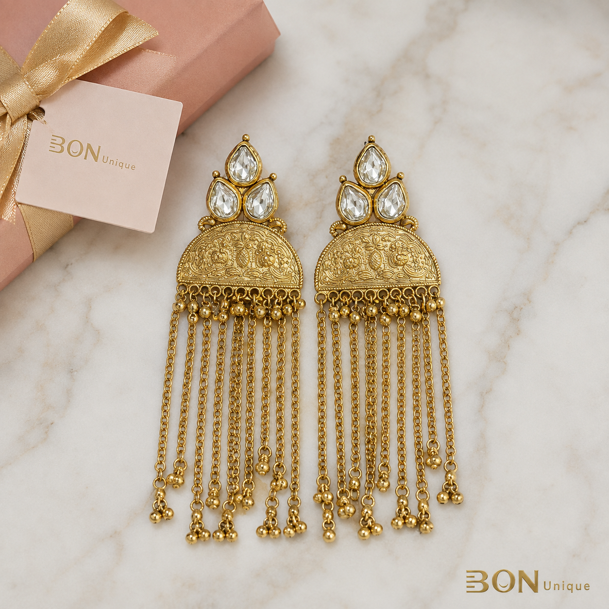 Antique Gold Kundan Tassel Chain Earrings flat lay with BON Unique gift box