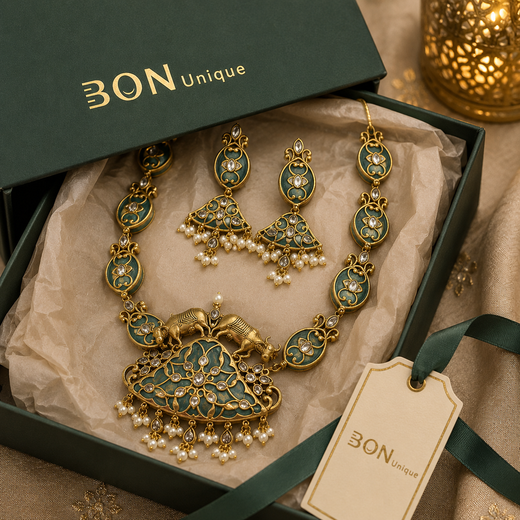 Antique gold dual elephant necklace set with teal enamel and chandelier earrings in BON Unique signature gift box