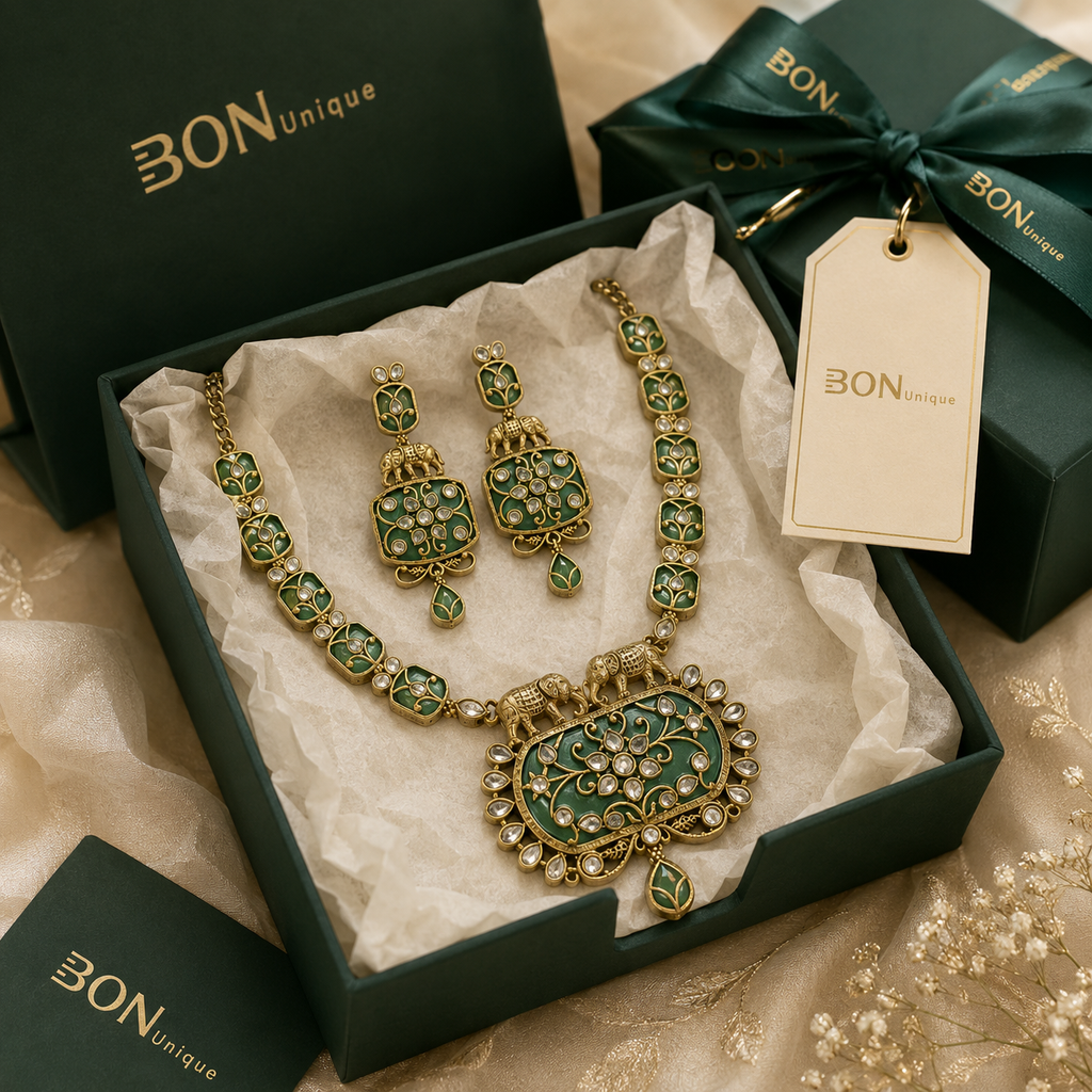 Antique gold elephant necklace set with green enamel and matching earrings in BON Unique signature gift box